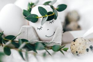 pexels-photo-6897770-6897770 A whimsical Easter egg with a hand-drawn smile and leaf crown, perfect for festive decor inspiration.